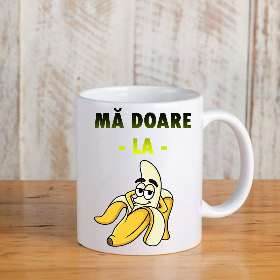 Cană cu mesaj amuzant: Mă doare la banană, ceramică, albă