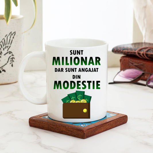 Cană cu mesaj: Sunt milionar, dar sunt angajat din modestie